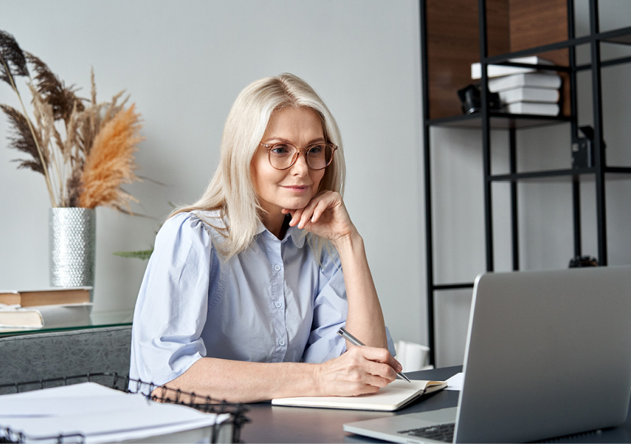 Woman at desk with laptop