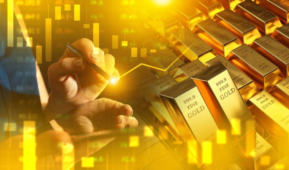 Image of gold bars with a stocks and shares graph over the top