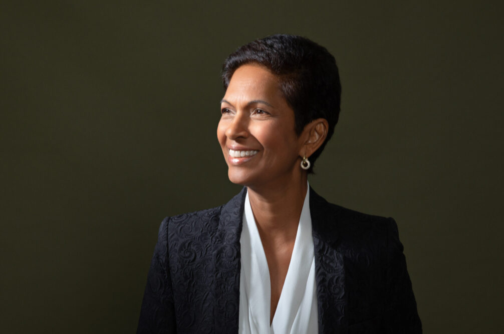 profile shot of Gina Miller, black suit white blouse