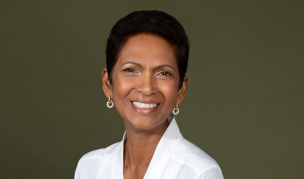 Head and shoulder shot off Gina Miller in a white blouse